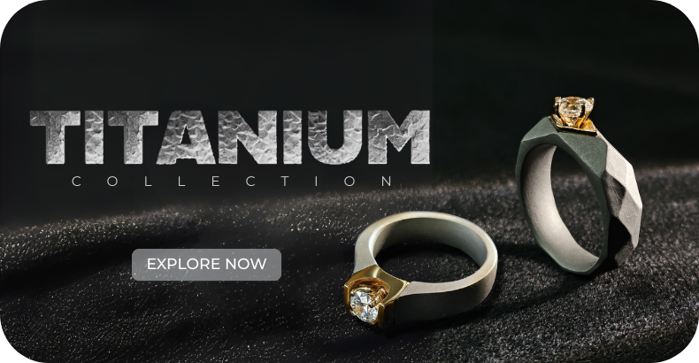 A high-contrast studio shot showcasing two bold, modern engagement rings from the Titanium Collection. The ring on the left features a squared titanium band with a striking gold bezel holding a radiant diamond. The ring on the right has a faceted, black titanium band with a smaller, elevated gold setting and a single diamond. Both rings are set against a dark, textured background, highlighting their unique and contemporary designer style. Designer diamond rings