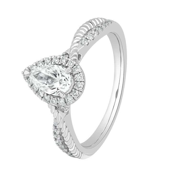 Angled view highlighting the pear-shaped halo center stone and the intricate twisted band design with pavé diamonds.
