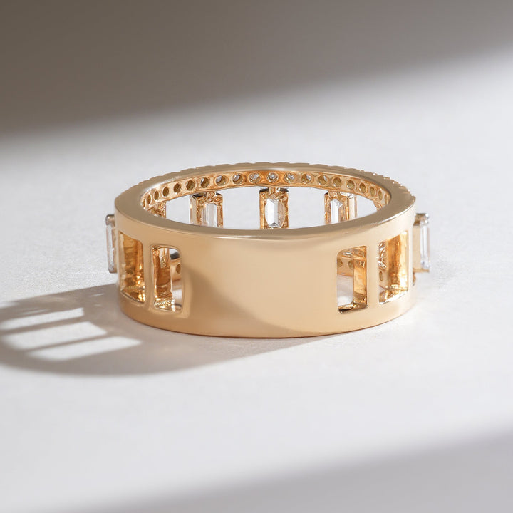 Back view of polished gold half-eternity band with open gallery design.