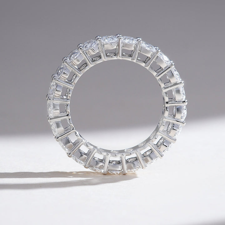 Profile view showing ring thickness and secure shared-prong and channel construction beneath the stones.