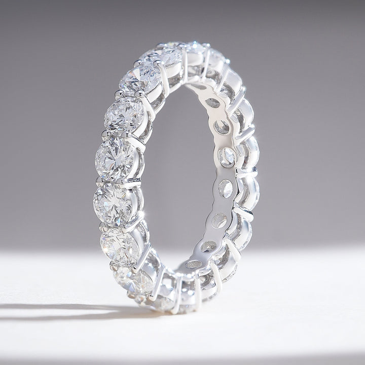 Side profile showcasing the open gallery design and intricate prong work of the 3.4 Ct Round Joint Eternity Band.