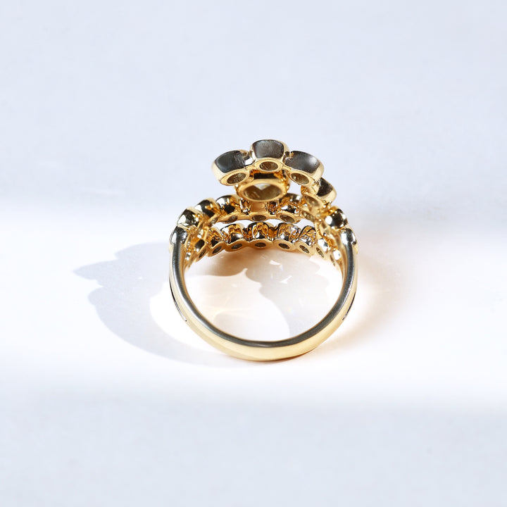 Back view of 3 ct round ray cocktail ring in yellow gold