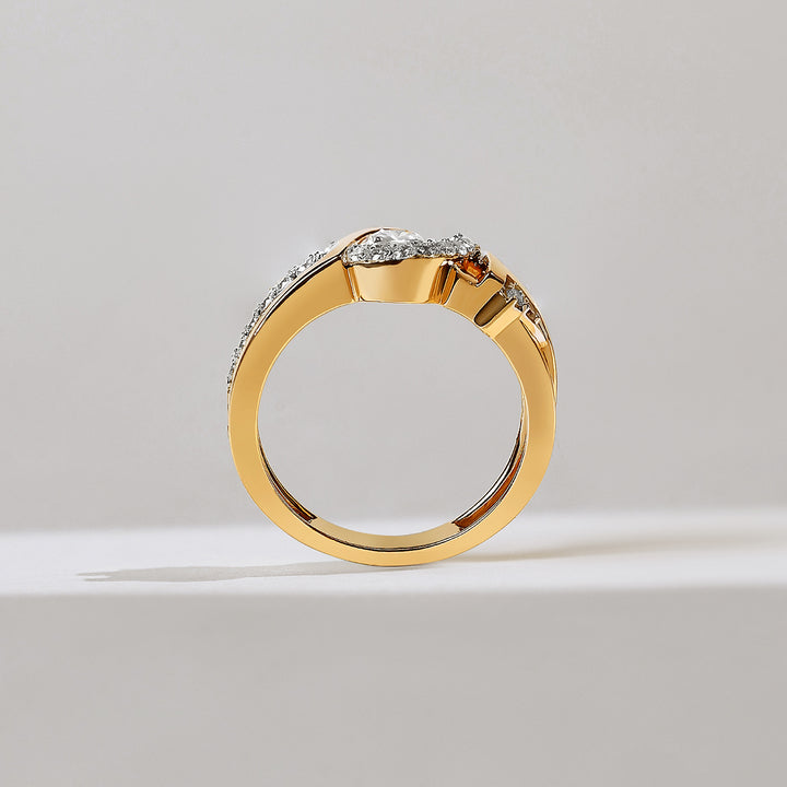 Gold ring with diamonds on a light gray background