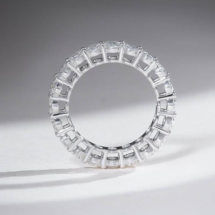 Top profile of 4-carat oval-cut diamond eternity band in white gold, crafted for maximum sparkle.