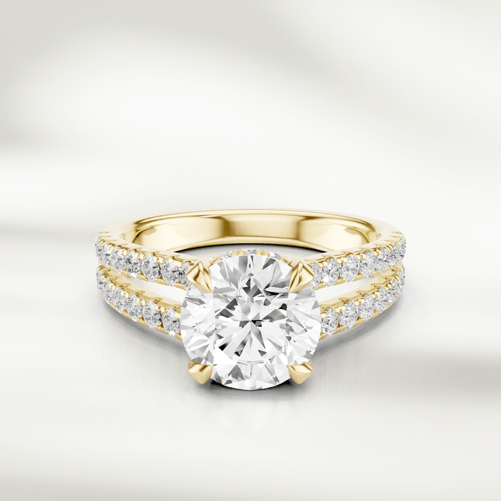 Front view of the 1 Ct Eira Solitaire Ring in champagne gold, featuring a round brilliant-cut diamond with a split shank accented by pavé diamonds.