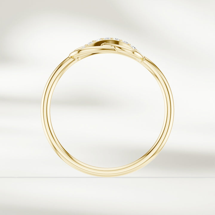 Side profile of gold infinity knot diamond ring with slim polished band