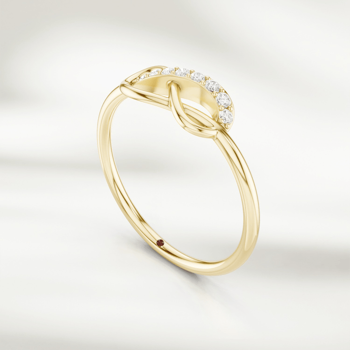 Gold infinity knot diamond ring with pavé-set accents and slim band