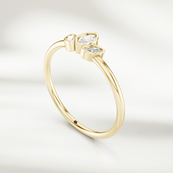 Angled view of gold marquise diamond cluster ring with three marquise diamonds in petal arrangement
