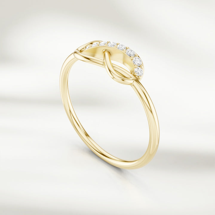 Gold infinity knot diamond ring with pavé-set accents and slim band