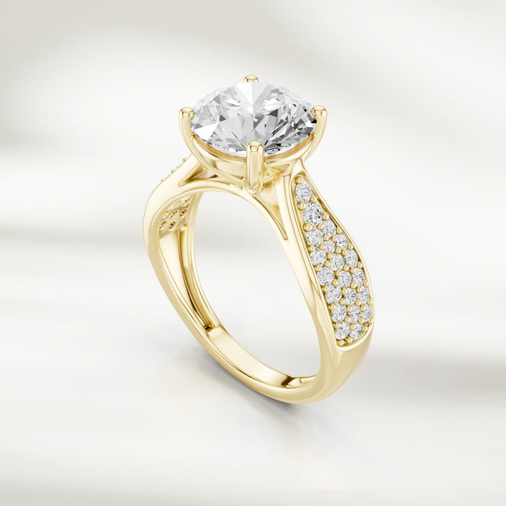 Angled view of the Infinite Love 2 Ct Round Solitaire Ring showing the pavé diamond detailing on the band.