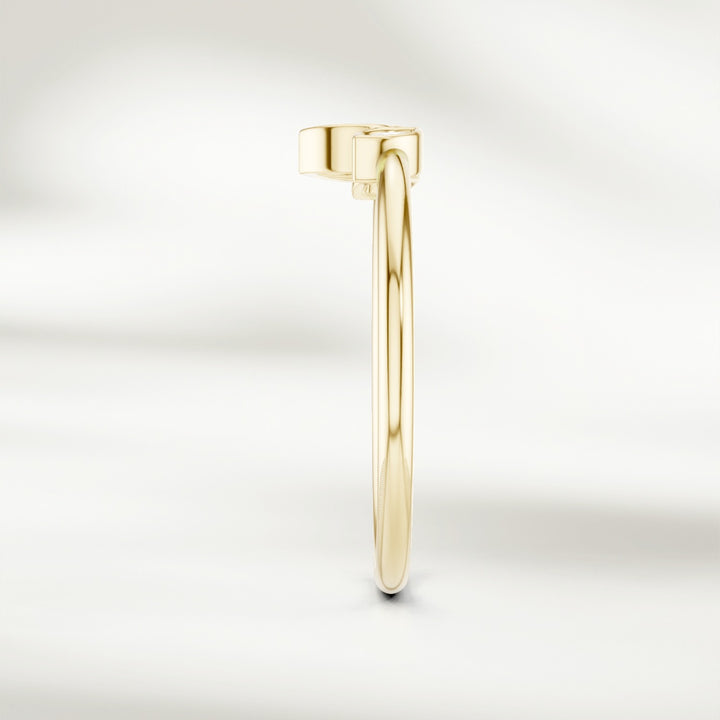 Side profile of gold marquise diamond cluster ring with slim polished band