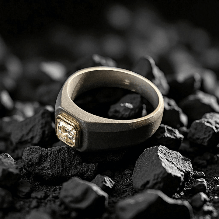 0.8 Ct Colossus Titanium Ring placed on black stones with gold bezel diamond.