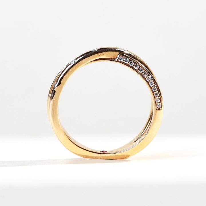 Front profile of the GemScope Promise Ring with diamond accents along the curved band.