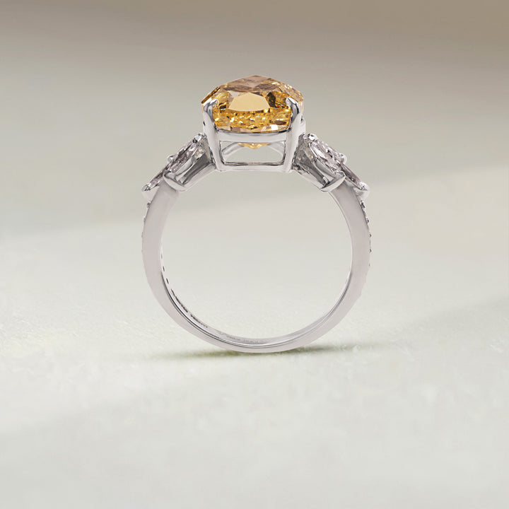Profile view of Golden Bloom Cocktail Ring with yellow diamond centerpiece and floral motifs.
