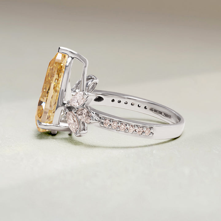 Side profile of Golden Bloom Cocktail Ring with pear-cut yellow diamond and floral side detailing.