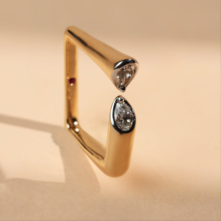 Angled side view of Prism Reflection Promise Ring showcasing modern square band and dual pear-cut diamond tips.