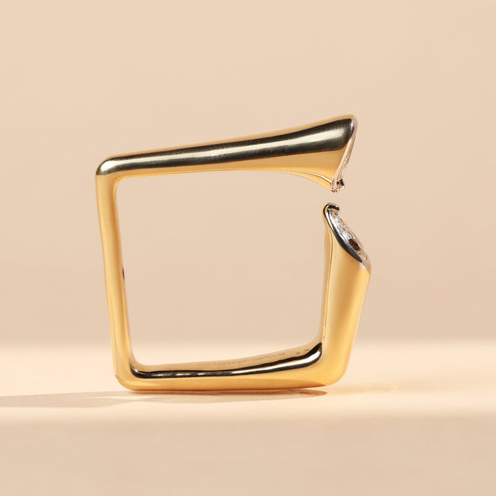 Side profile of Prism Reflection Promise Ring with artistic open square design and opposing pear-cut diamonds.