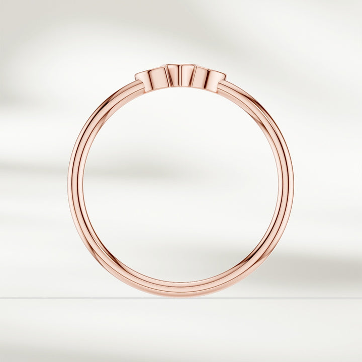 Side profile of 9kt rose gold marquise diamond cluster ring with slim polished band