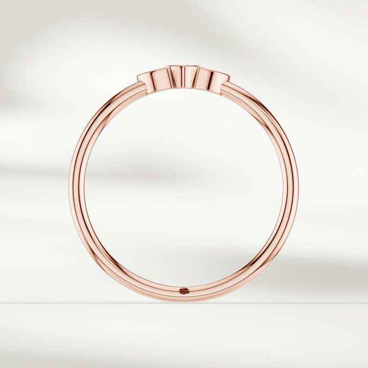Side profile of 9 kt rose gold marquise diamond cluster ring with slim polished band