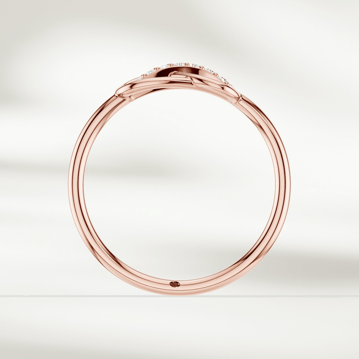Gold infinity knot diamond ring with raised setting and slender band