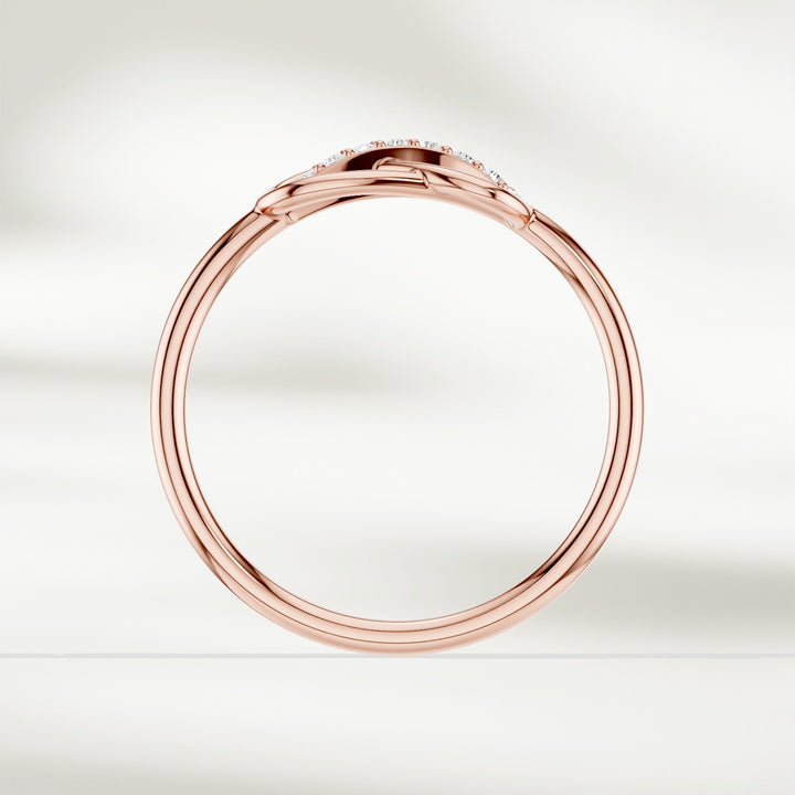 Gold infinity knot diamond ring with raised setting and slender band