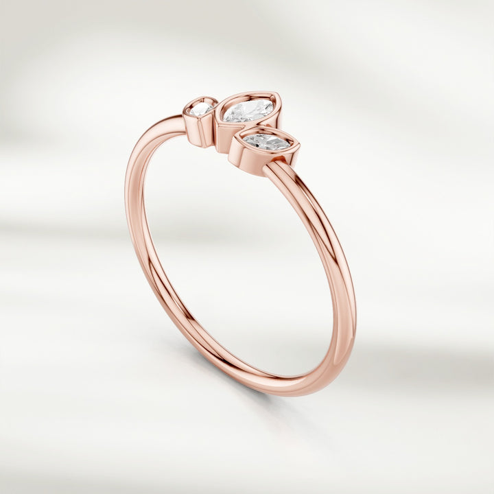 Angled view of 9kt rose gold marquise diamond cluster ring with three marquise diamonds in petal arrangement