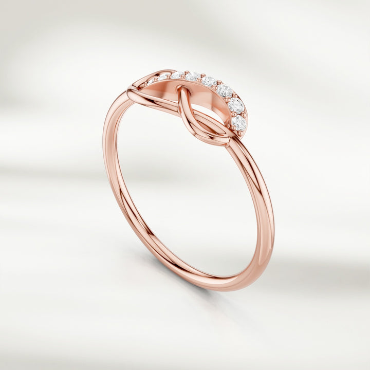 Gold infinity knot diamond ring with pavé-set accents and slim band