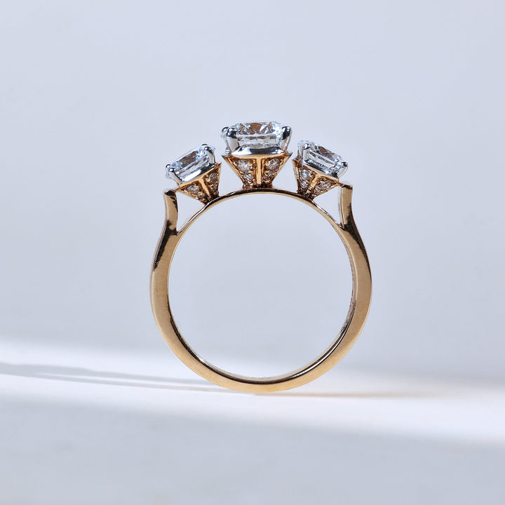 side profile showing three-diamond setting in symmetry