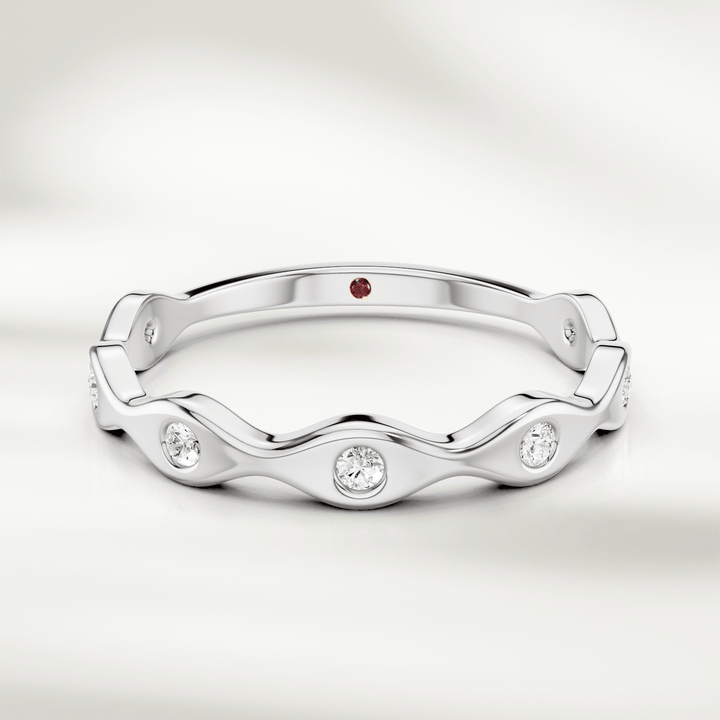 Wavy diamond band ring in 9kt yellow gold with bezel-set round diamonds