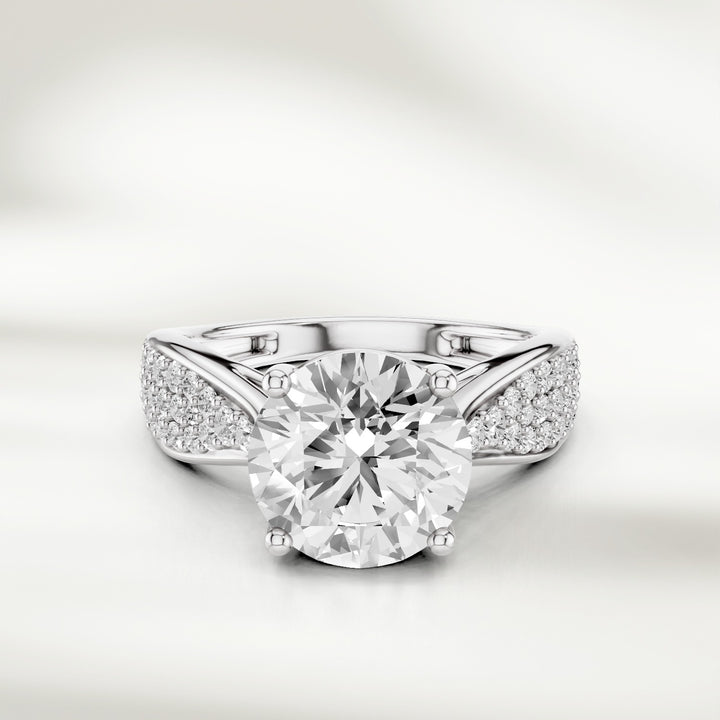 Infinite Love 2 Ct Round Solitaire Ring in white gold with diamond-studded shank, front view.