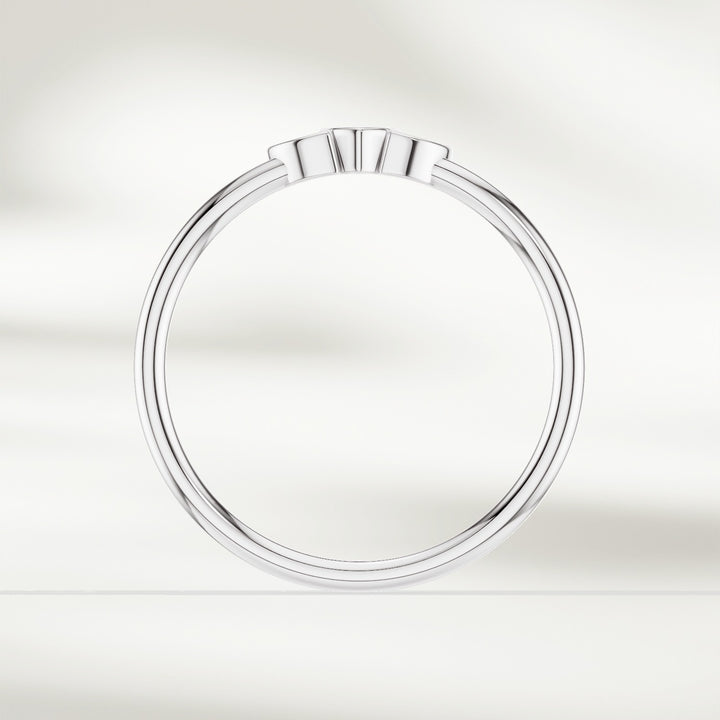 Side profile of 9kt white gold marquise diamond cluster ring with slim polished band
