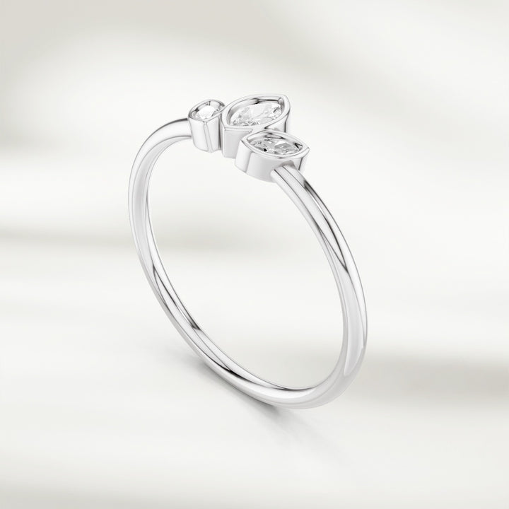 Angled view of 9kt white gold marquise diamond cluster ring with three marquise diamonds in petal arrangement