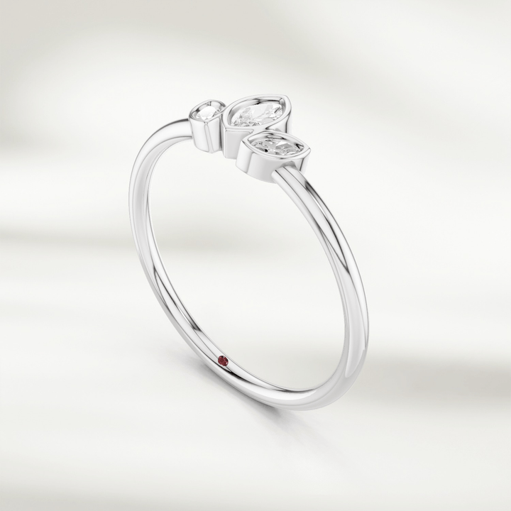 Angled view of gold marquise diamond cluster ring with three marquise diamonds in petal arrangement