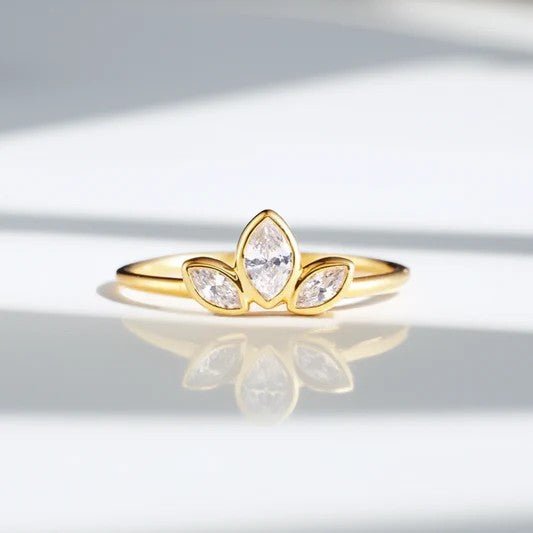 Three marquise diamond cluster ring in yellow gold with slim polished band