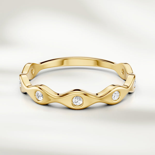 Wavy diamond band ring in 9kt yellow gold with bezel-set round diamonds