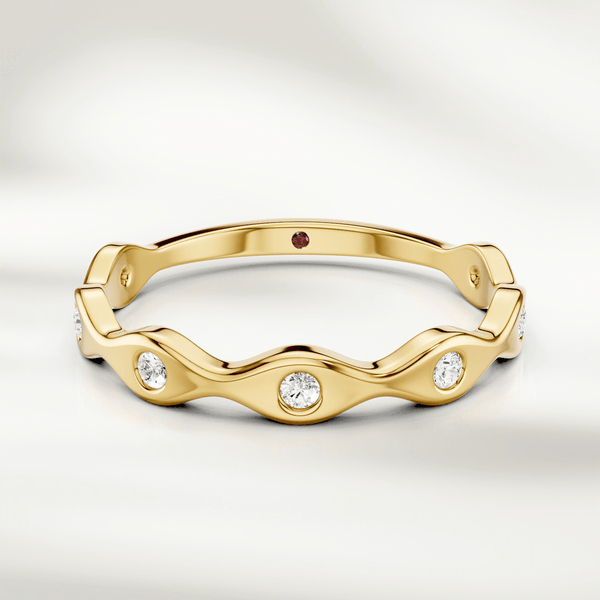 Wavy diamond band ring in 9kt yellow gold with bezel-set round diamonds