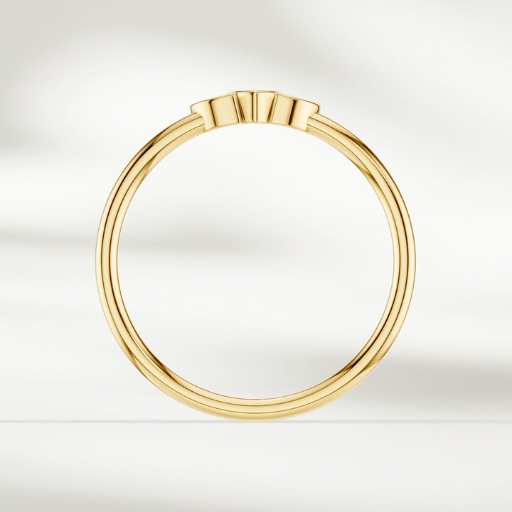 Side profile of 9 kt yellow gold marquise diamond cluster ring with slim polished band
