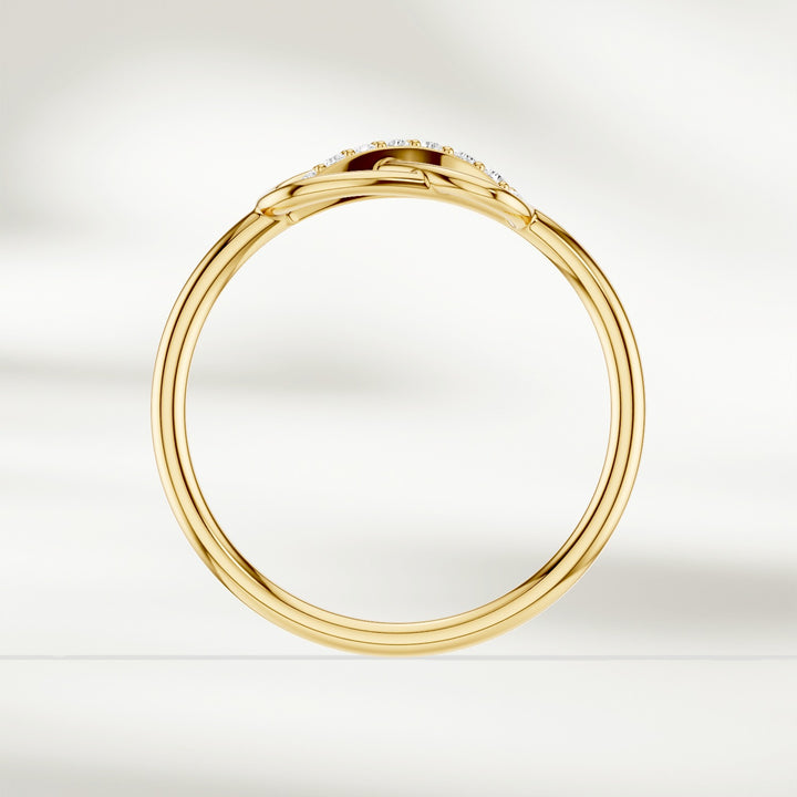 Side profile of gold infinity knot diamond ring with slim polished band