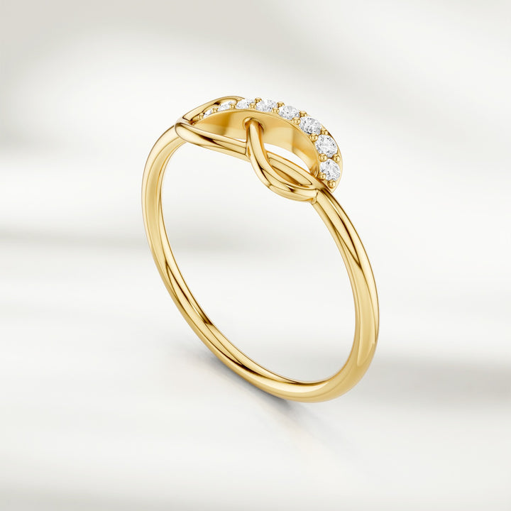 Gold infinity knot diamond ring with pavé-set accents and slim band