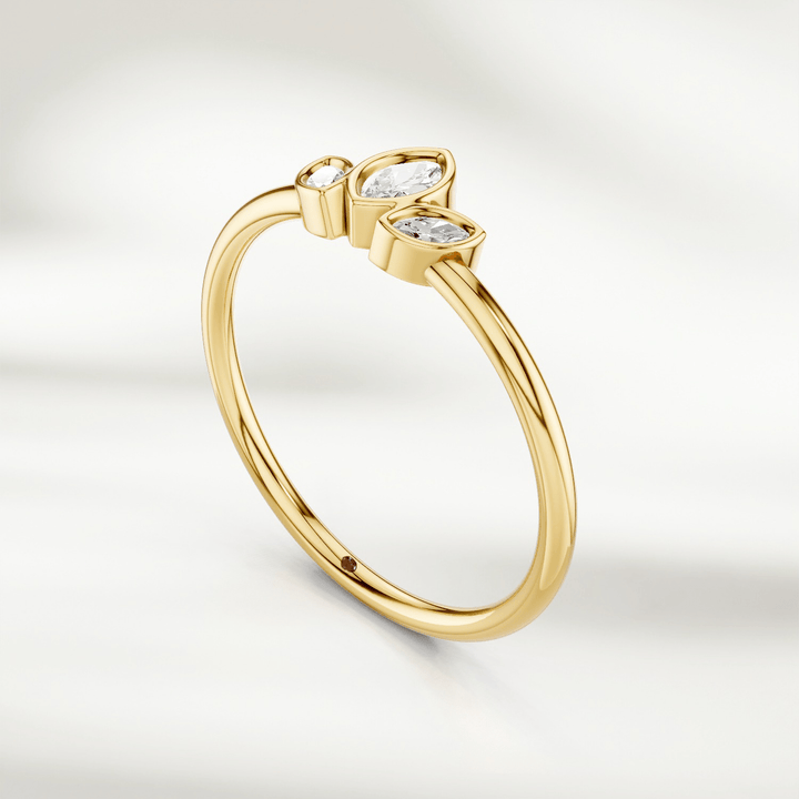 Angled view of gold marquise diamond cluster ring with three marquise diamonds in petal arrangement