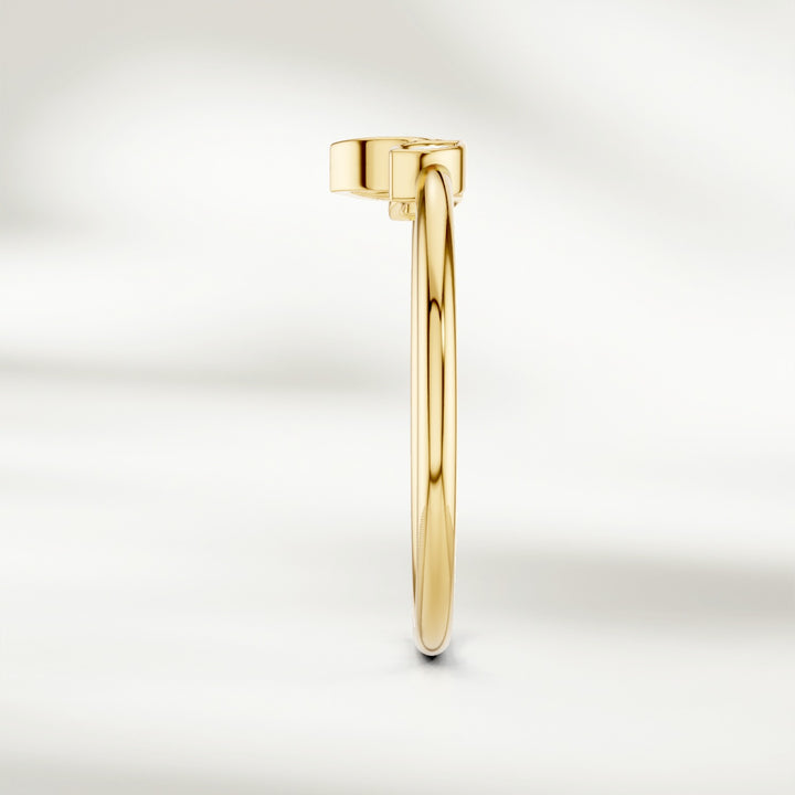 Side view of gold marquise diamond cluster ring with slim band and raised petal-inspired setting