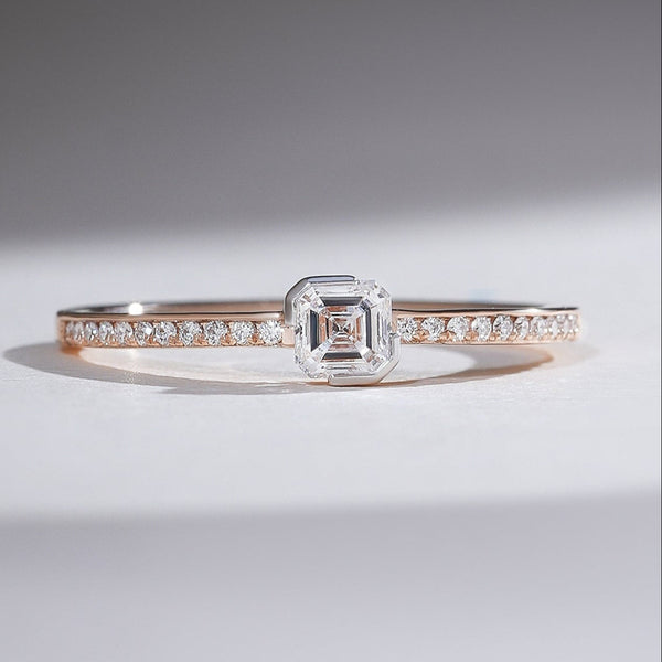Front view of 0.3 Ct Aria Asscher Solitaire Ring in rose gold with diamond-studded band.