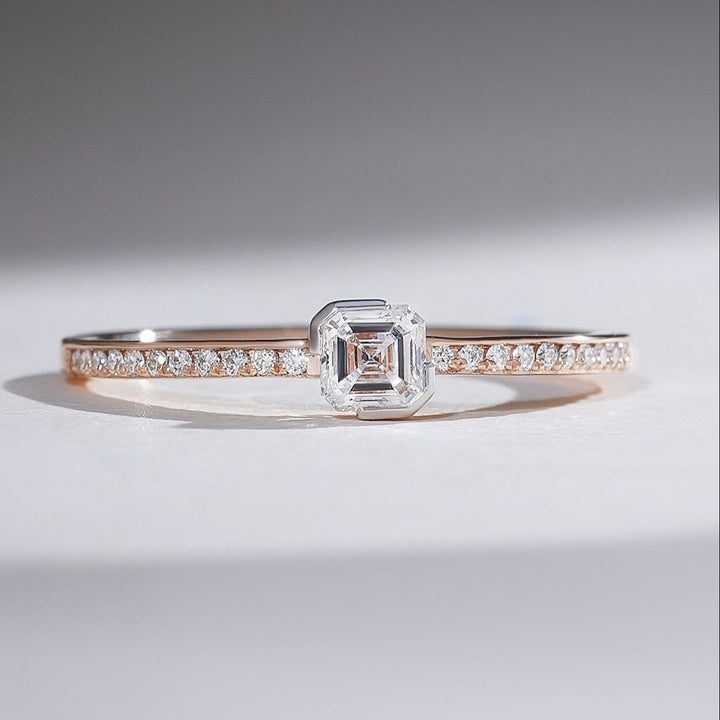 Front view of 0.3 Ct Aria Asscher Solitaire Ring in rose gold with diamond-studded band.