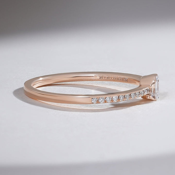 Side profile of 0.3 Ct Aria Asscher Solitaire Ring showing rose gold setting and pavé diamonds.