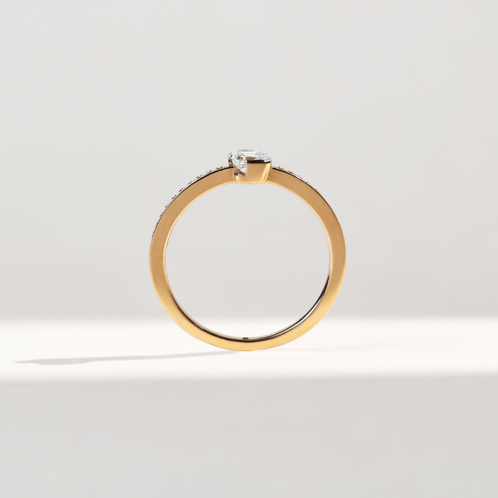 Side profile of 0.3 Ct Aria Asscher Solitaire Ring showing rose gold setting and pavé diamonds.