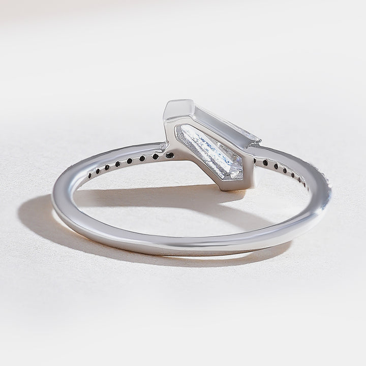 Back view of shield-cut diamond solitaire ring in white gold with pavé-set accents