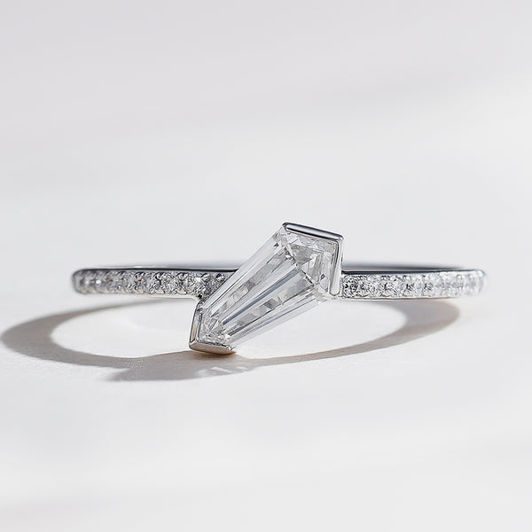 Shield-cut diamond solitaire ring in Half Bezel setting, white gold and pavé-set band