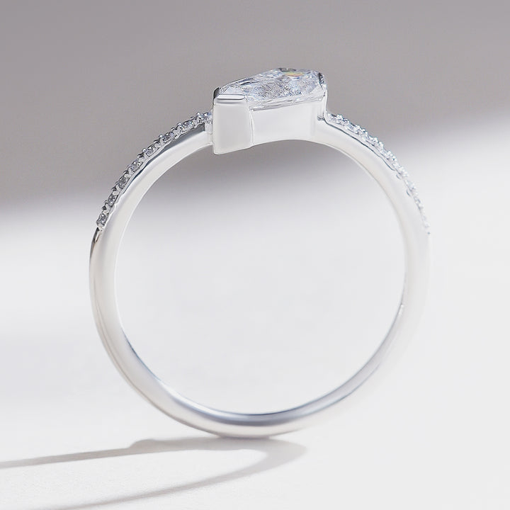 Side profile of 0.5 carat Aria shield solitaire ring in white gold with pavé-set band