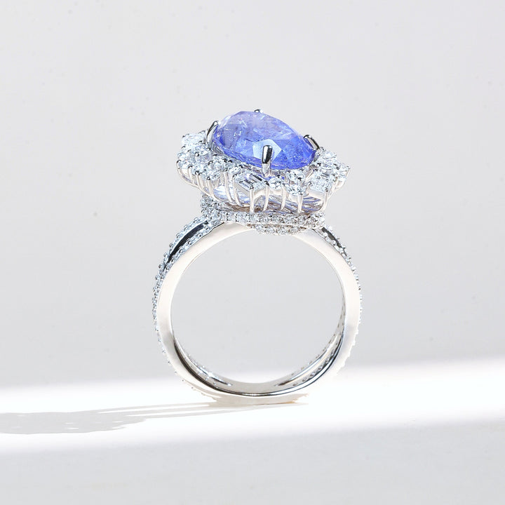 Side view of Azure Crest sapphire and diamond halo cocktail ring in white gold