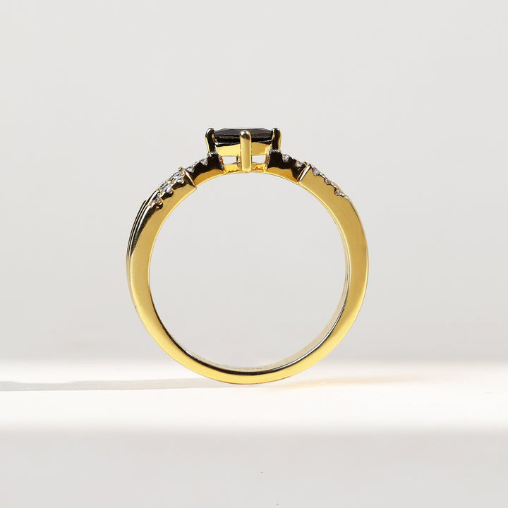 Profile shot of the Black Princess Fancy Ring highlighting its elevated black diamond and intricate dual diamond bands